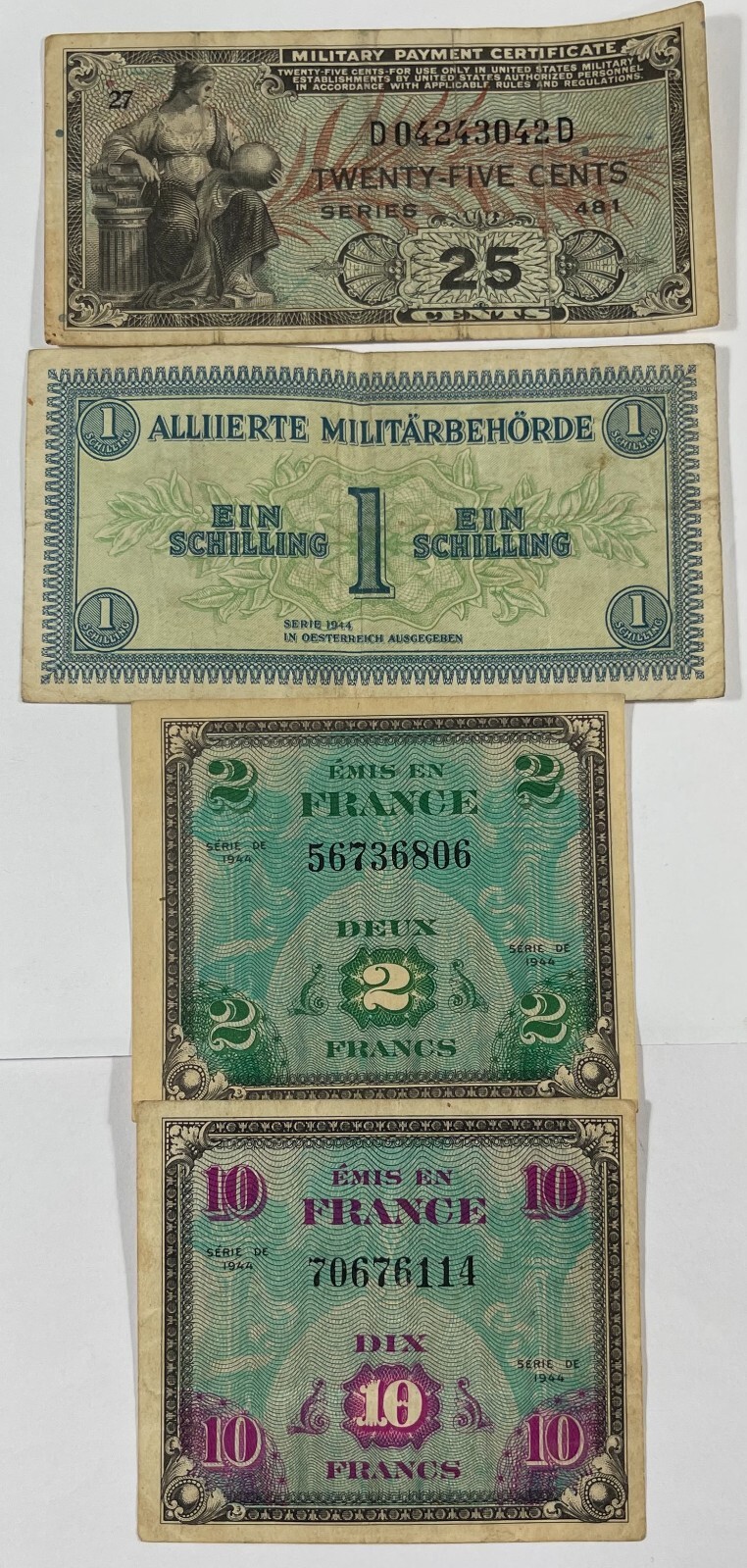 Military currency 8 different pcs. (#472) includes one US. Mixed quality.
