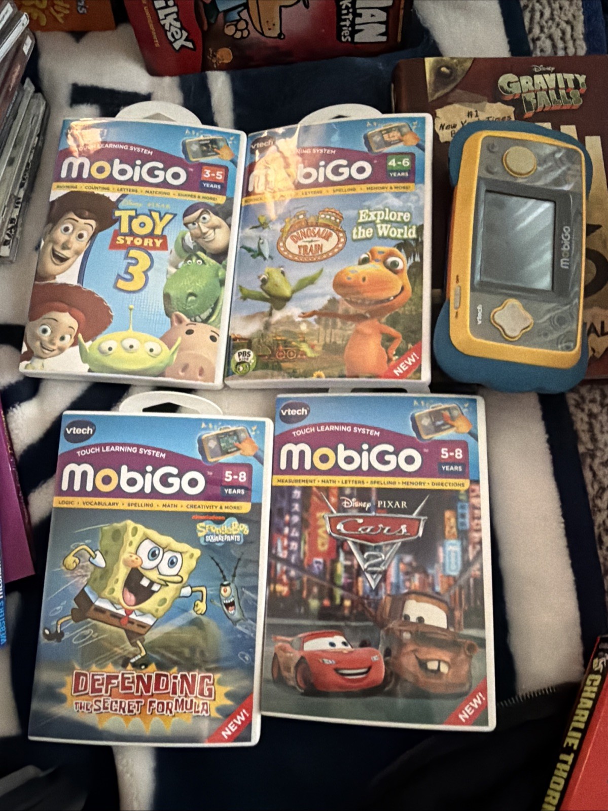 Lot 4 MobiGo Games VTech + Mobigo Console - Toy Story, Cars, Spongebob, Dinosaur