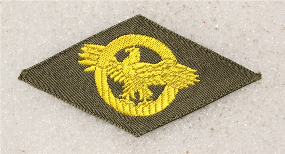 Cloth Army Badge 074: WWII Discharge Diamond, Ruptured Duck - woven on OD