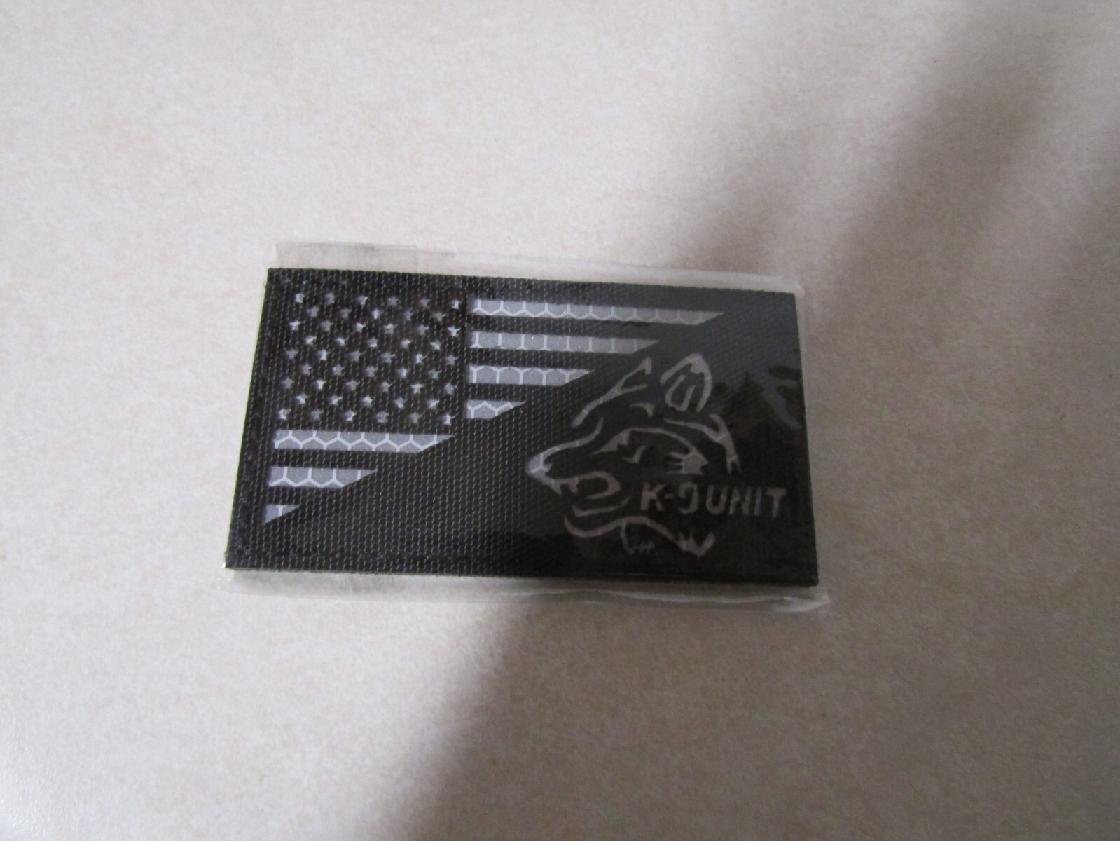 FLAG PATCH HOOK & LOOP APPROX 2 BY 3 1/2 IN K-9 UNIT DOG BLACK WHITE WRITING