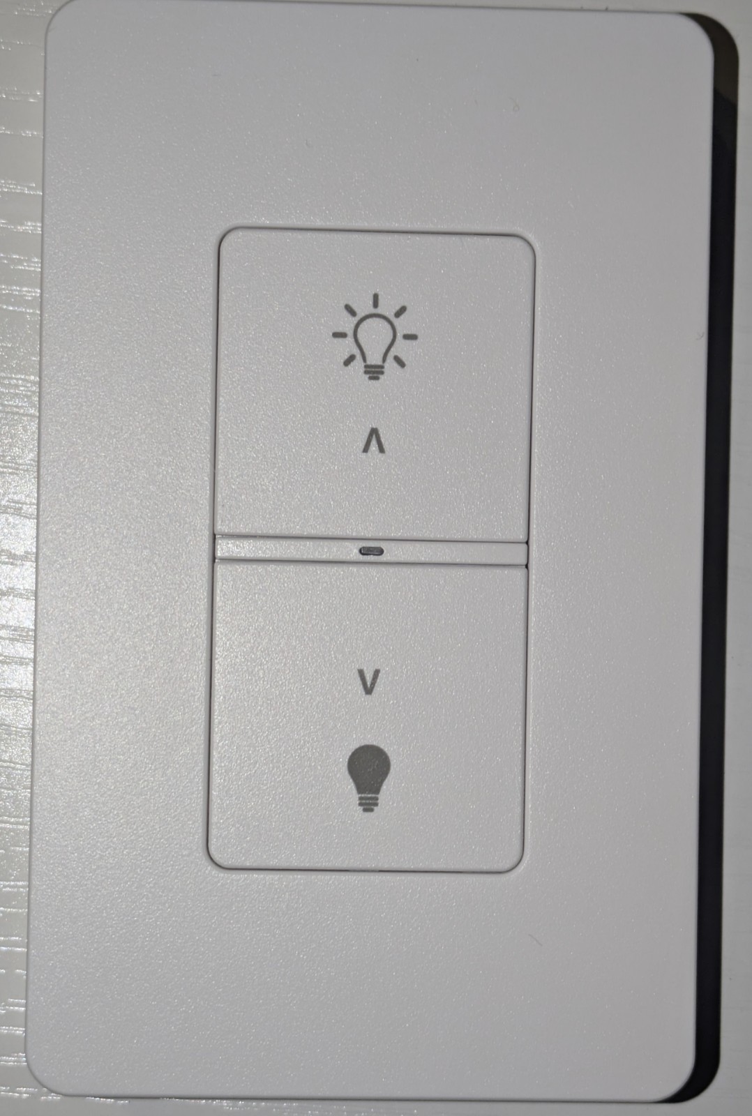Current wireless wall dimmer WWD2-2SM with batteries in new bulk packaging.
