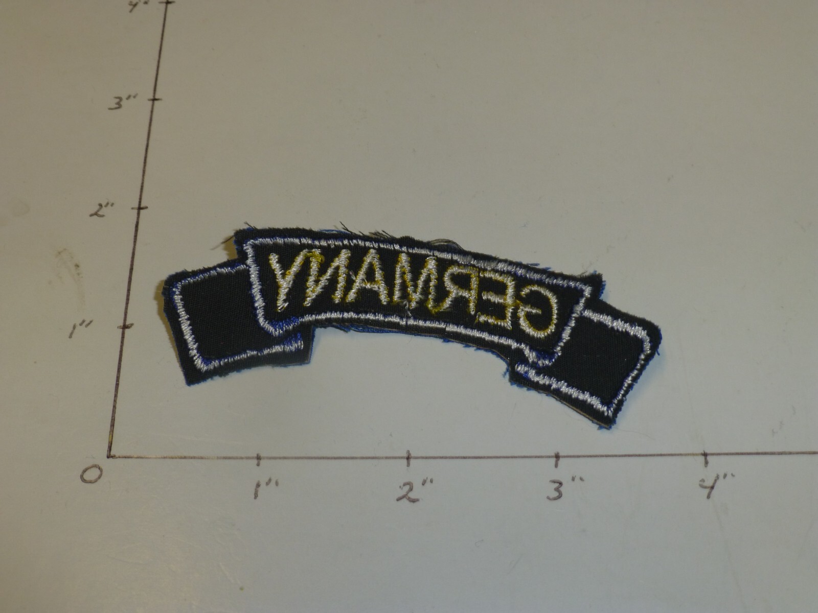 Germany tab gold letters blue border on blue for 8th Division patch