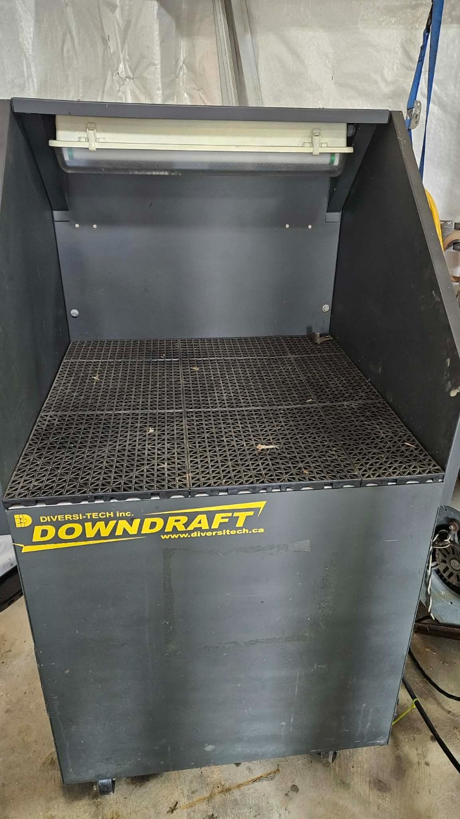 DIVERSI-TECH INC.  down draft bench only used twice. No longer needed  $2000