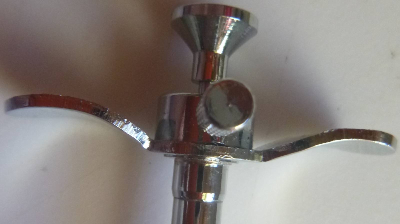 20 inch vinyl covered braided metal cable release with locking button.