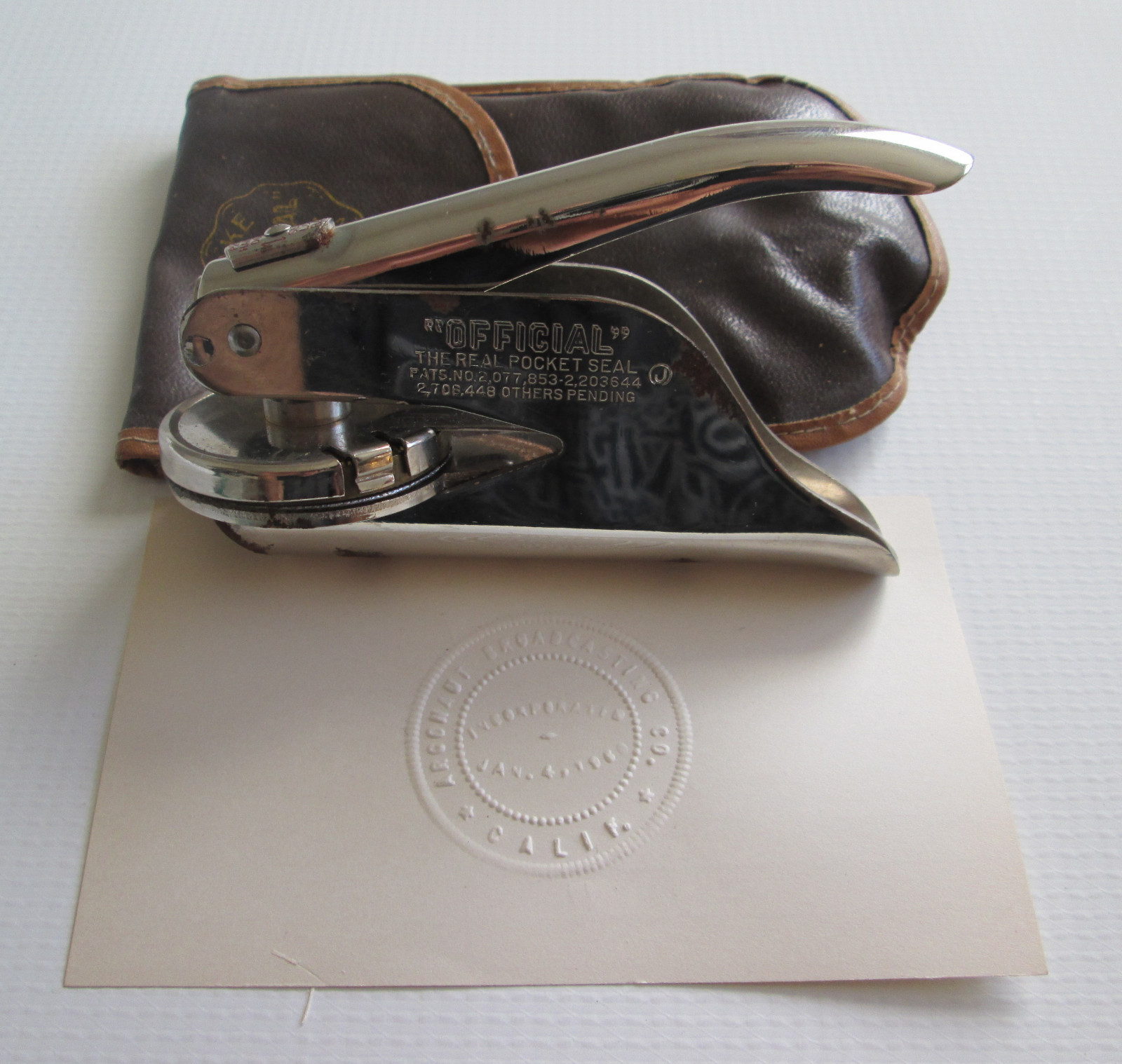 1960 CA Argonaut Broadcasting Hand Press Pocket Seal & Pouch Official Marking Co