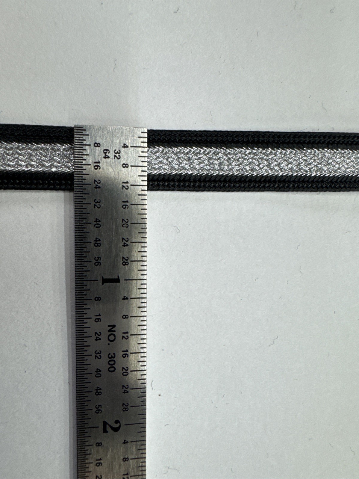 Rice Braid - 3/8” Black With Metallic Silver Center Stripe Braid. 144 Yards.