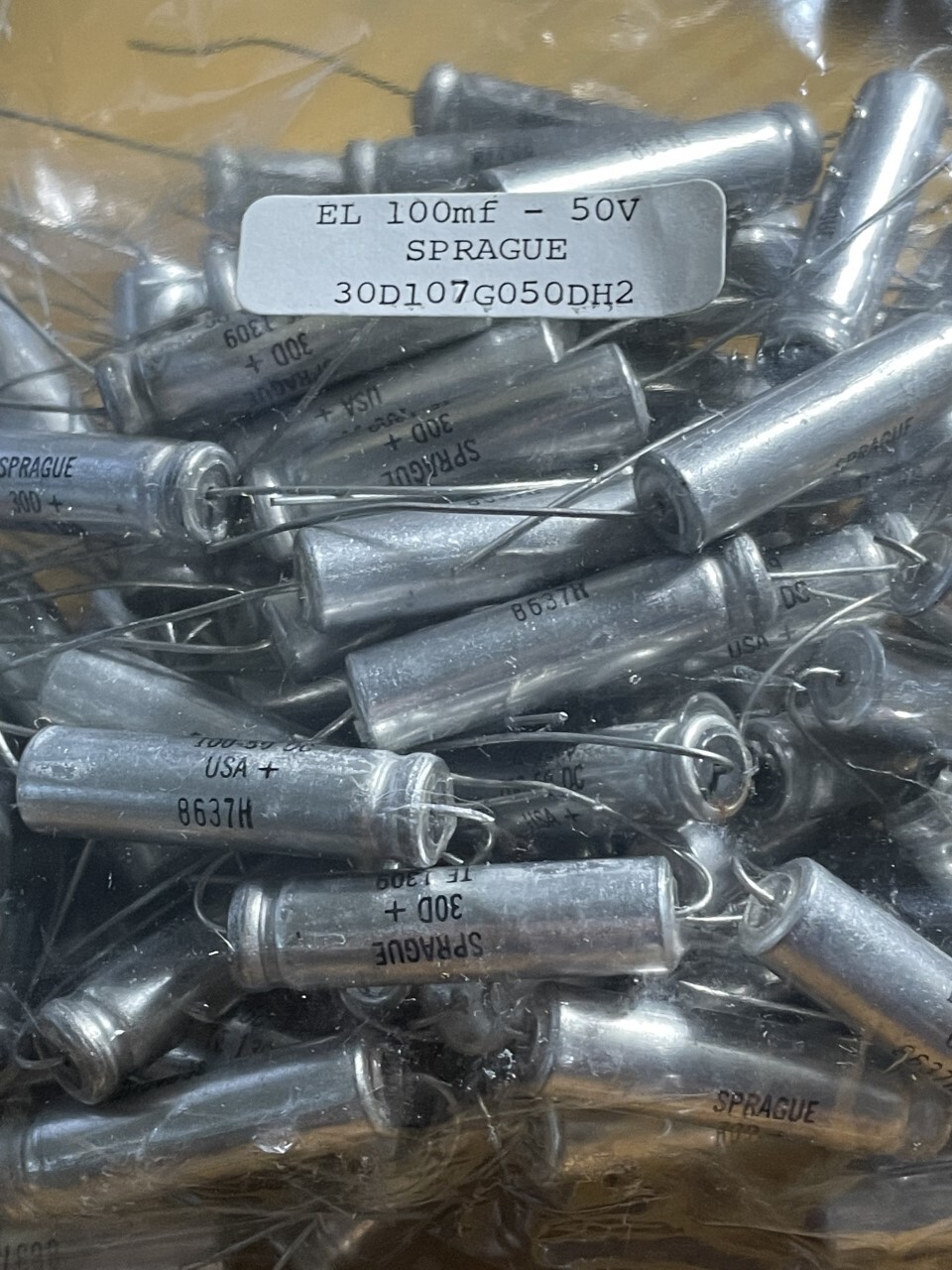 A lot of  4 Sprague Axial Electrolytic Capacitors 30D107G050DH2, 100 uf, 50V