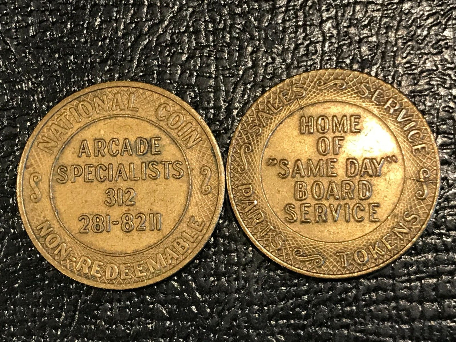 LOT OF TWO CHICAGO ARCADE SPECIALIST SALES SERVICE PARTS & TOKENS-DEC066