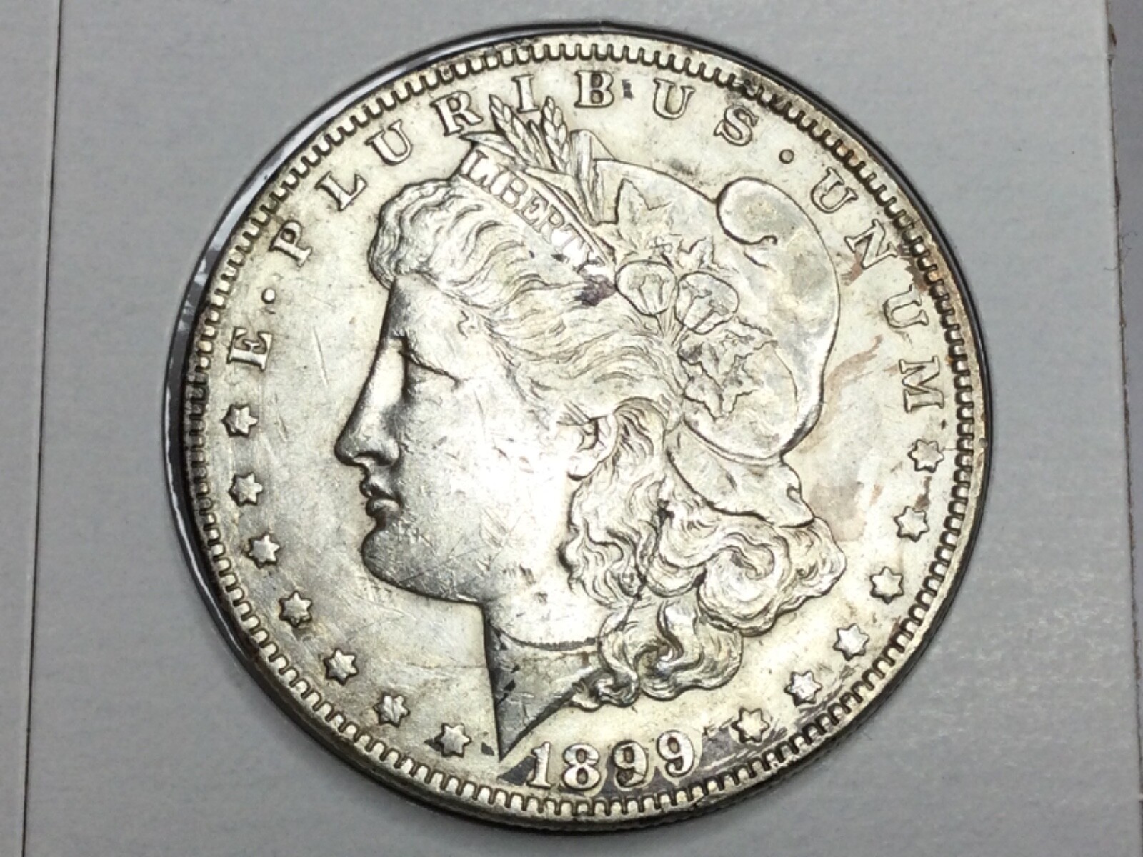 1899-O micro O Morgan Dollar in almost uncirculated
