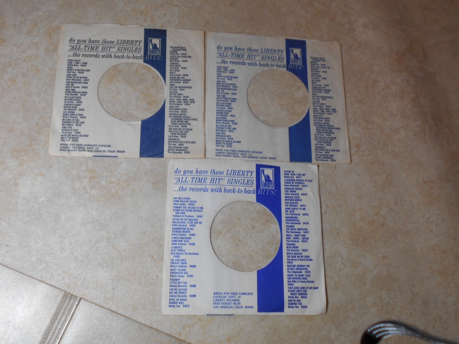 COMPANY  SLEEVES. LOT OF THREE LIBERTY ALL TIME HITS.  ARTISTS LISTED.