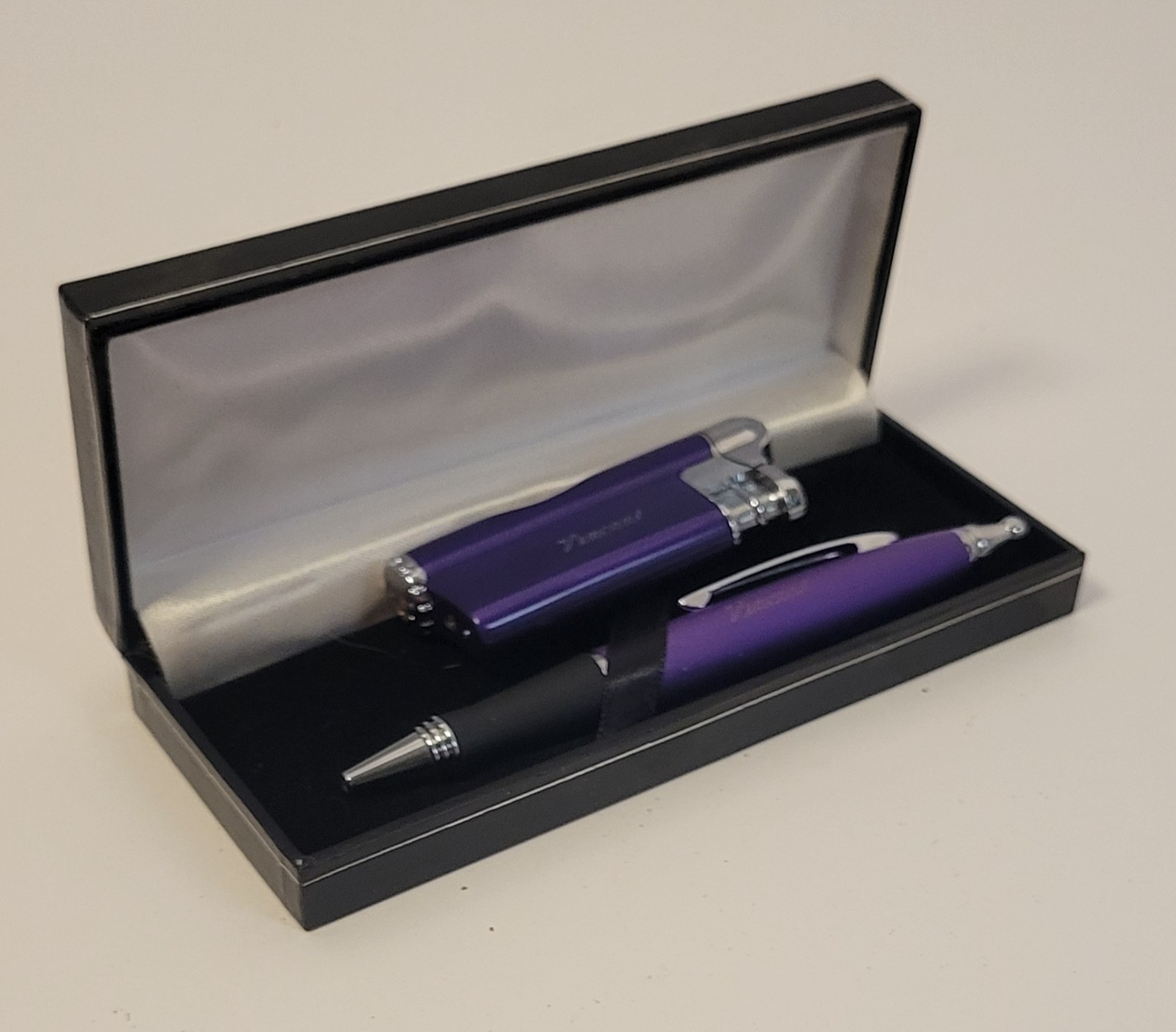 Pen and lighter set.  Engraved Vincent.  (or Vincent brand?) Dark purple color.