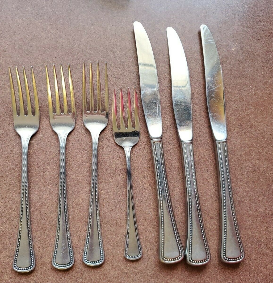 1881 Oneida Ltd 7pc Stainless Flatware Beaded Handle 4 Forks 3 Knives