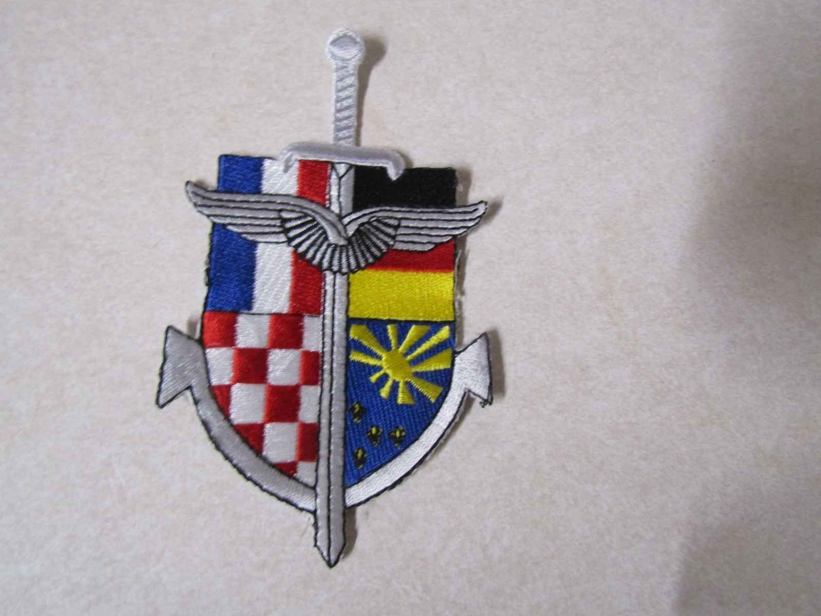 MILITARY PATCH UNSURE FOREIGN SWORD WITH FLAGS OF GERMANY NETHERLANDS ETC
