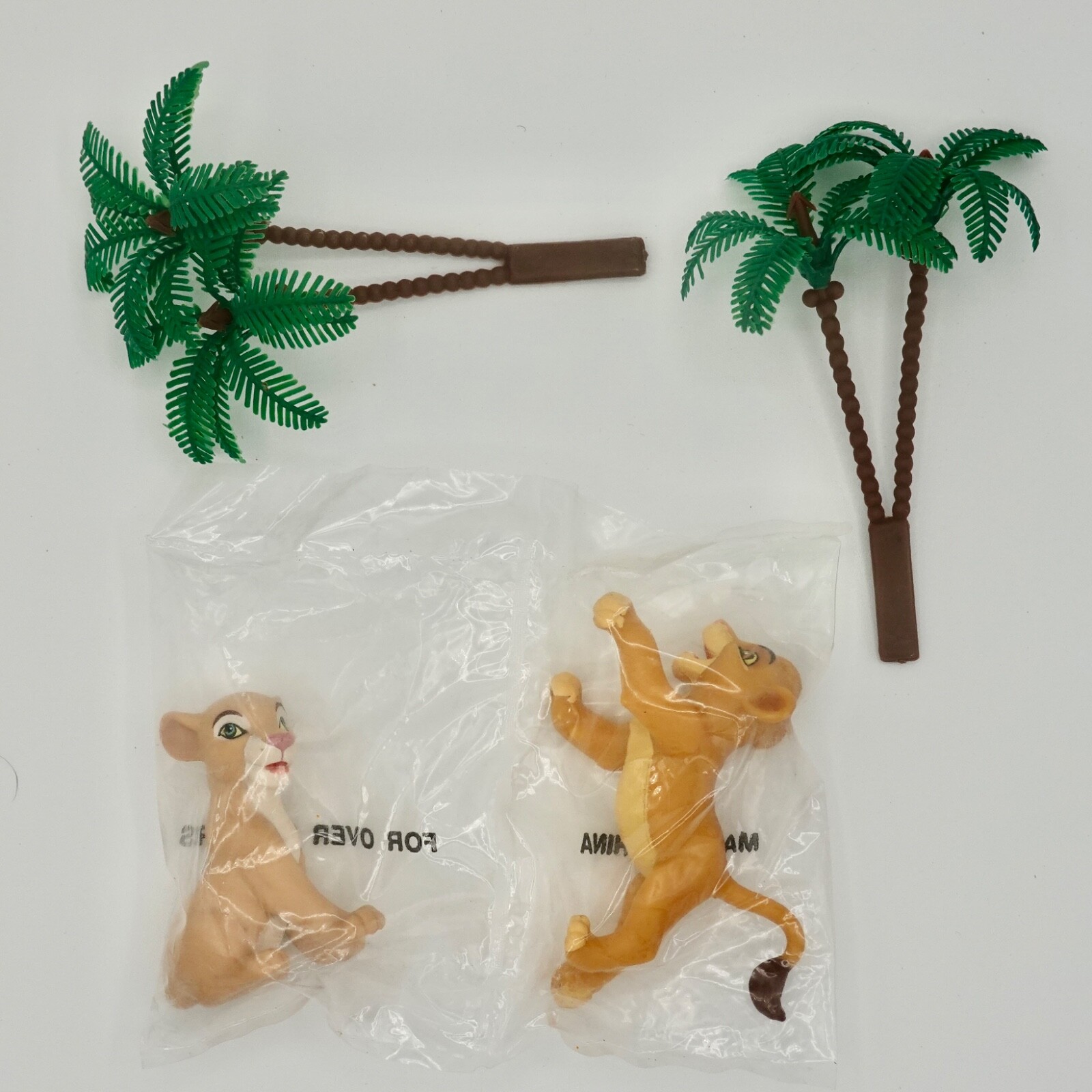 2 Lion Cubs and 2 palm trees Cake Toppers
