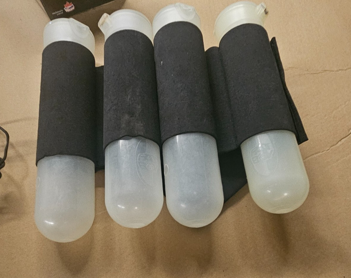 PRE-OWNED, FAIRLY NEW/CLEAN, PAINTBALL TUBES WITH ELASTIC BELT