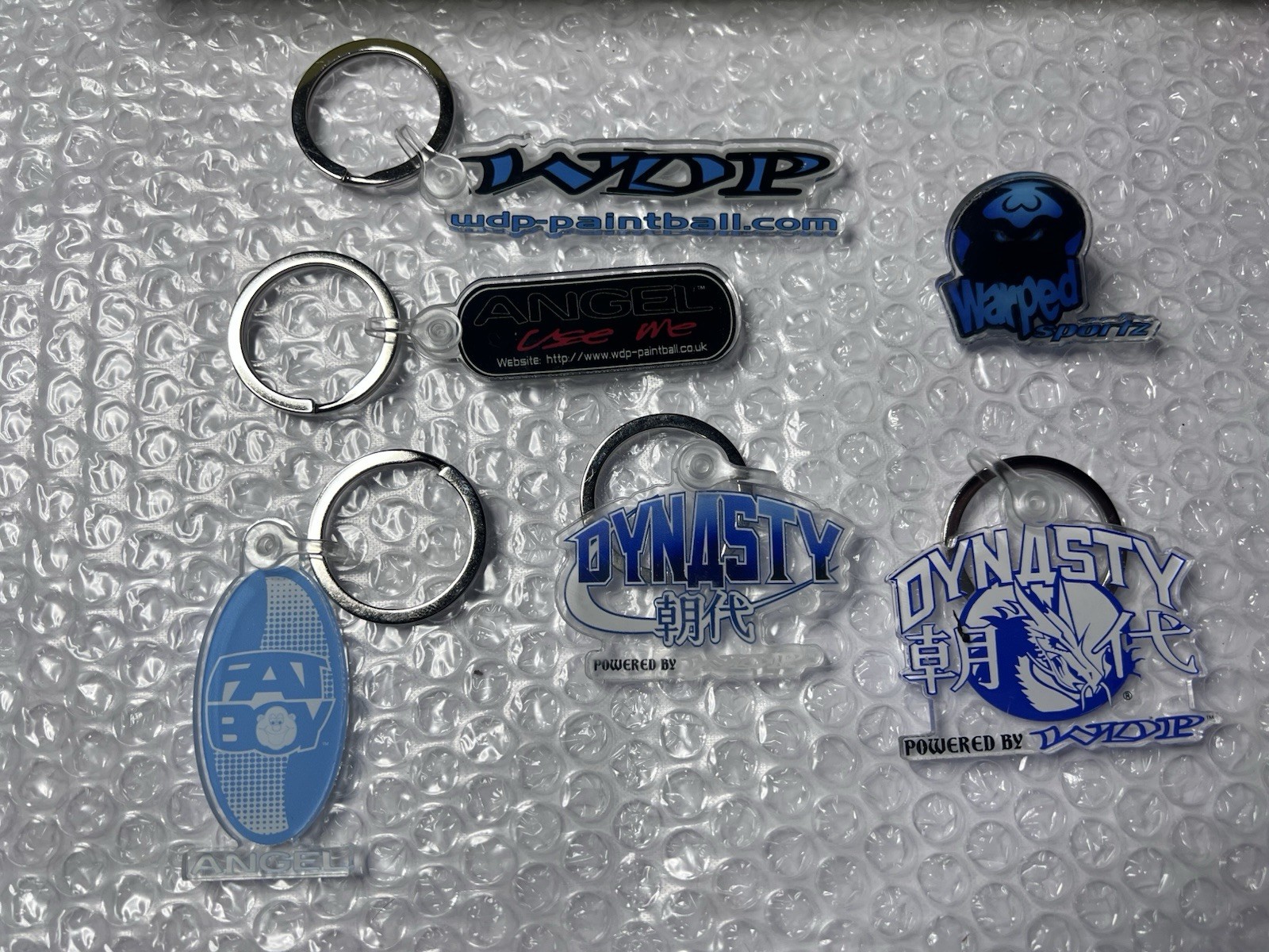WDP Angel Dynasty Paintball Keychain Lot  - 4 Keychains & One Warped Sportz Pin