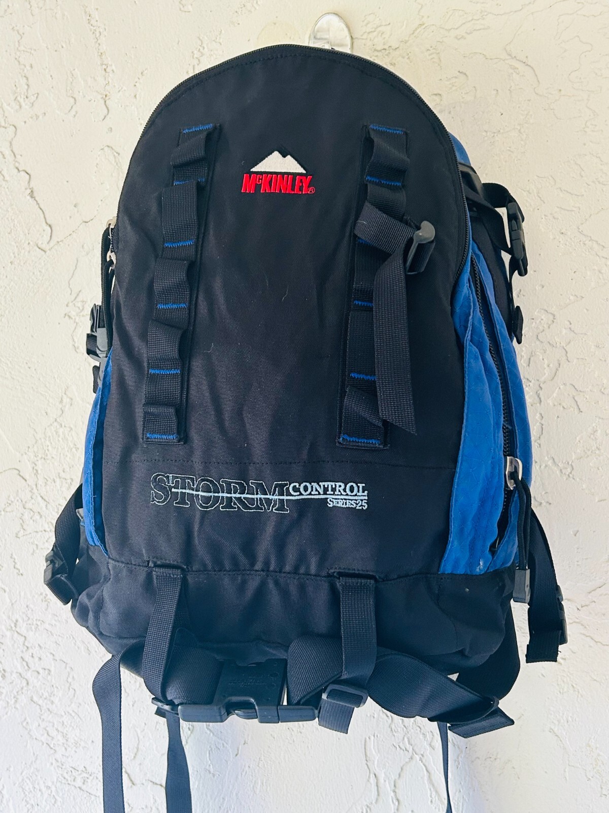 McKinley Hiking Camping Storm Control Backpack (Blue, Red and White)