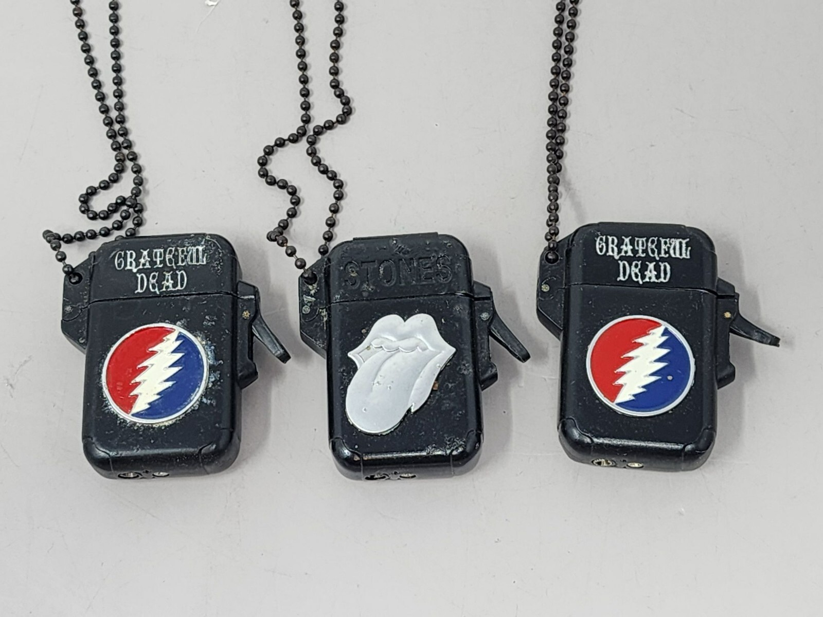 2Grateful Dead & 1Rolling Stones Lighters Black Chain Necklace C&D Visionary Inc