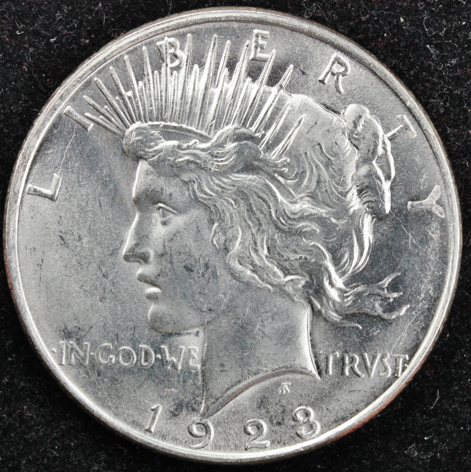 1923-d Peace Silver Dollar.  Well Struck for a 1923-d.  BU. (Inventory A)