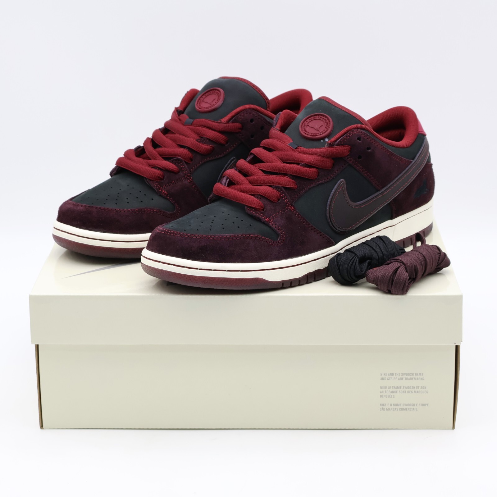 FZ1289-200 Riot Skateshop Nike SB Dunk Low Pro QS Mahogany and Team Red (Men's)