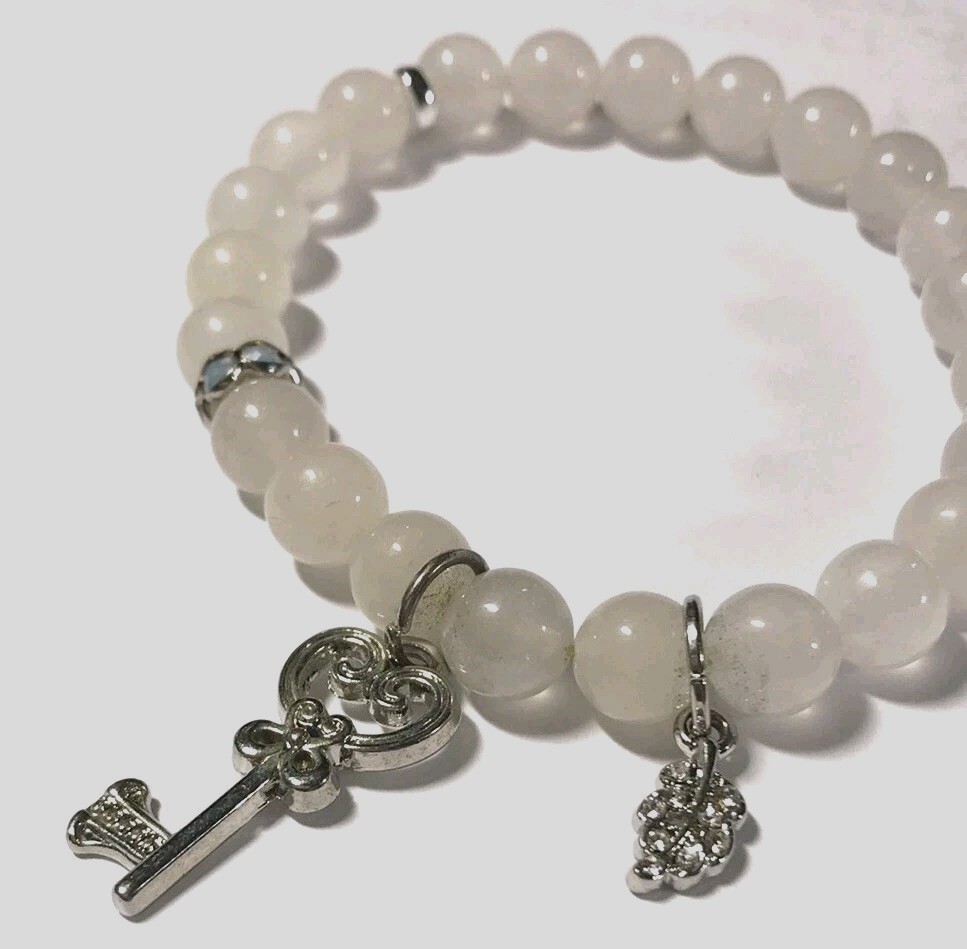 Pink quartz bracelet with silver tone key and leaf charms/ Stretch