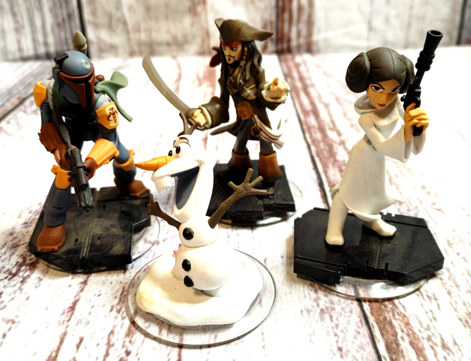 Disney Infinity Figures Lot of 4. Jack Sparrow, Boba Fett, Princess Leia + Olaf.