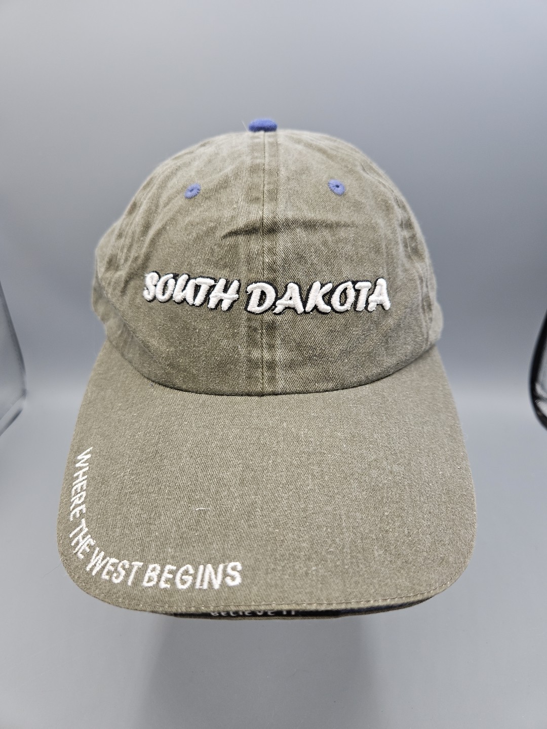 South Dakota Hat Spellout on Military Green Hat Dad Cap Where The West Begins