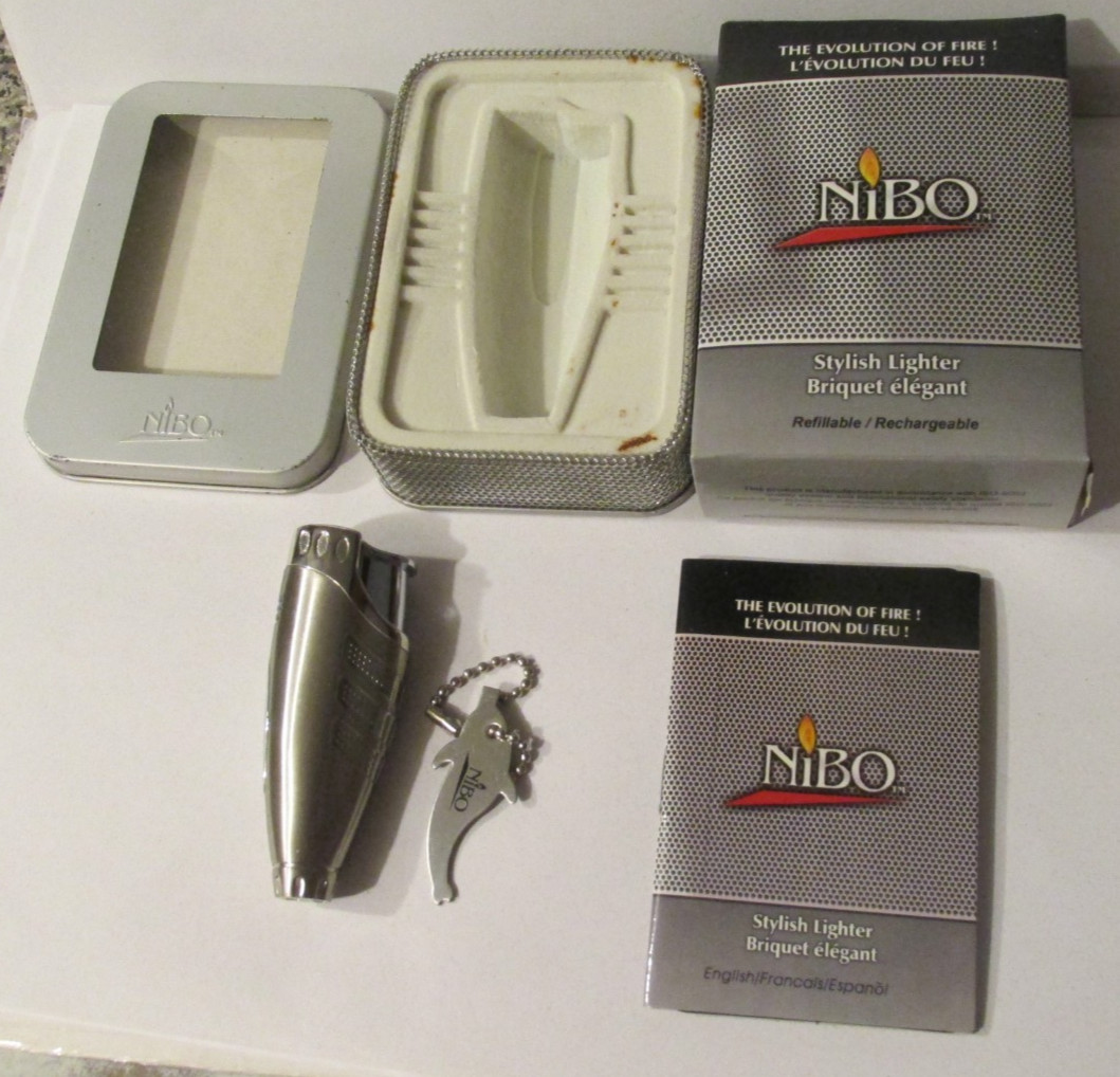 Wave 11 NIBO Stylish lighter In case Refillable  May 15 2003 Silver Color