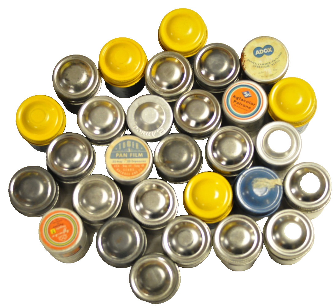 Lot 29 Kodak, Ansco, Agfa, Tower and Adox metal 35mm film canisters as shown.