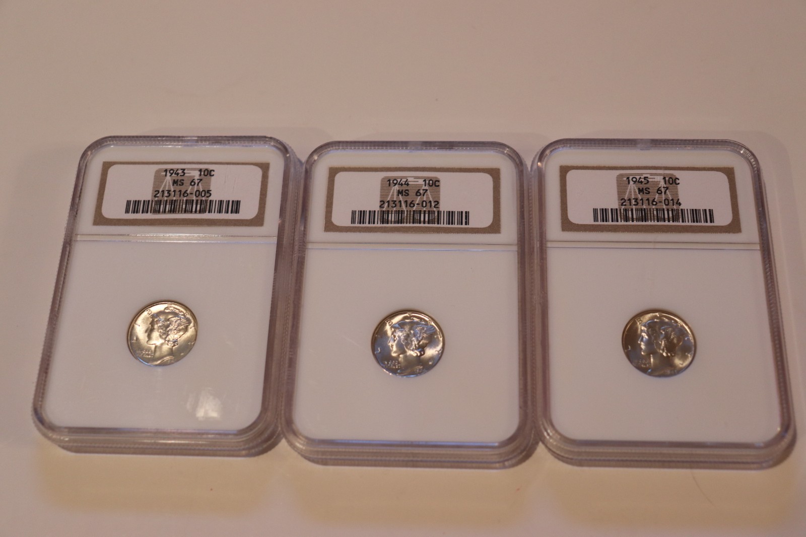 1943, 1944, 1945, Liberty Silver Dimes, NGC MS67.