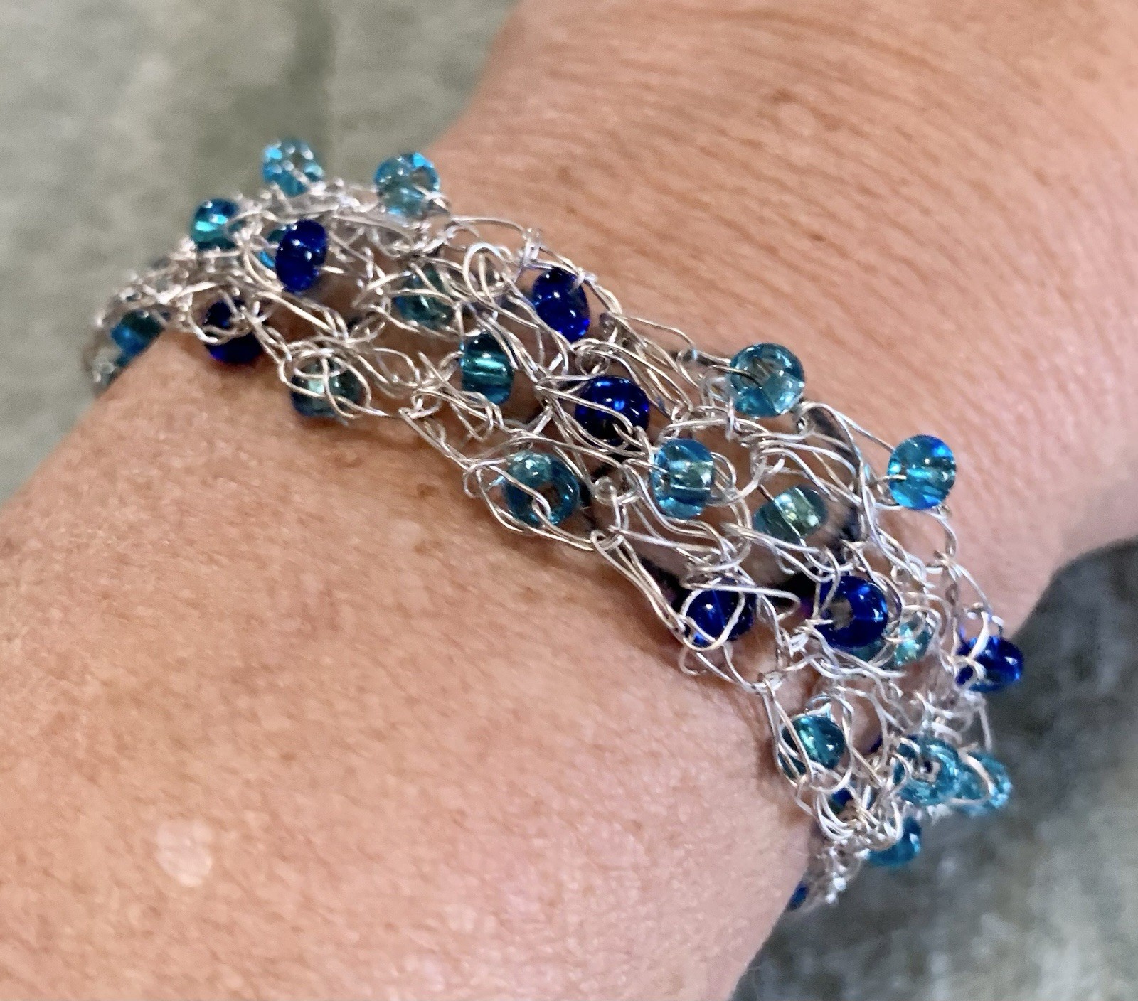 Handcrafted 7.25” Silver Wire Crochet Bracelet Featuring Blue Glass Beads
