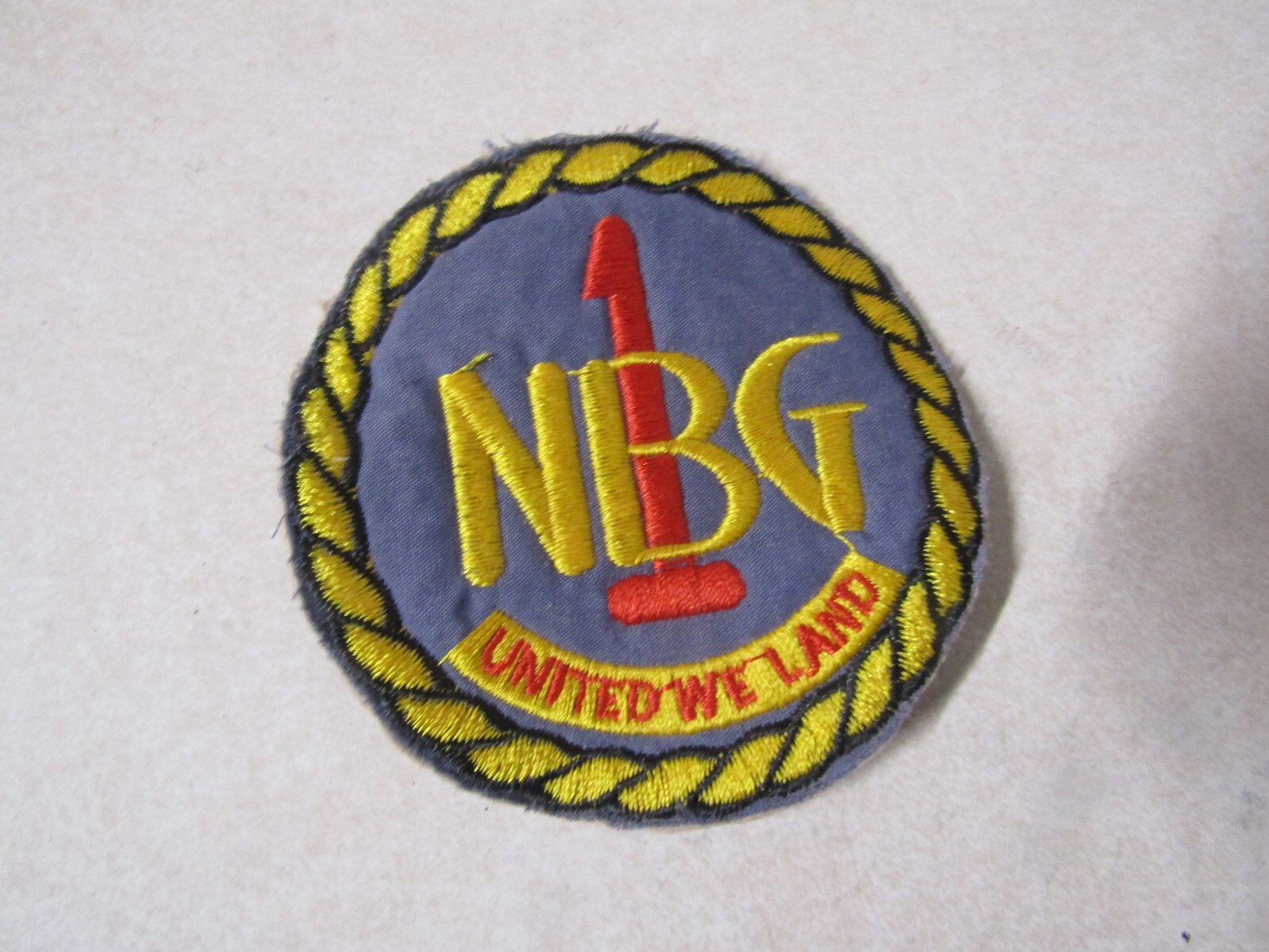 MILITARY PATCH SEW ON OLD VIETNAM ERA NBG 1 UNITED WE LAND