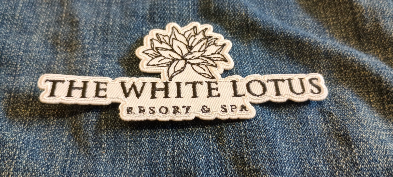 White Lotus Resort and Spa Logo 4.25 x 2 Inch Iron On Patch