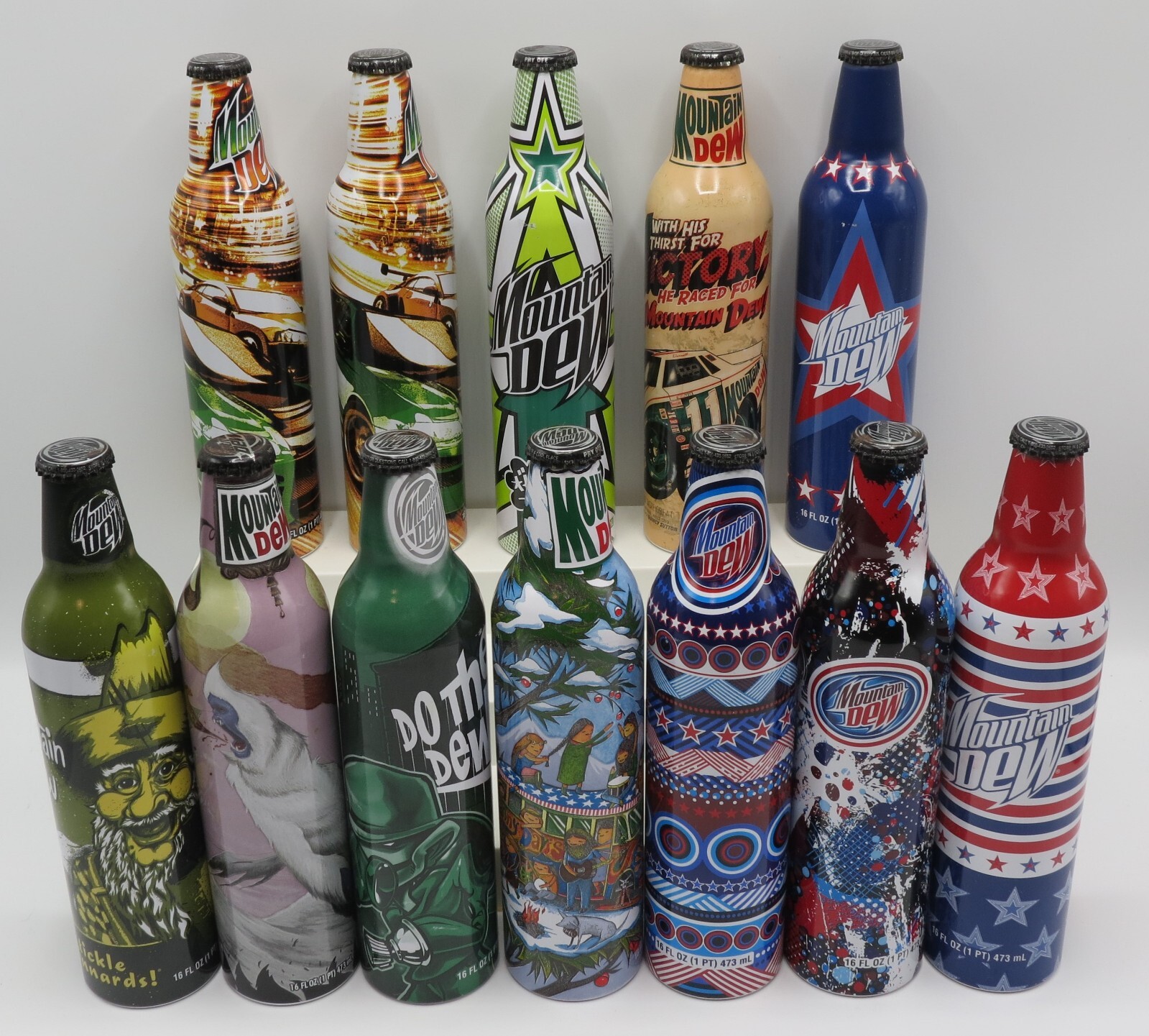 12 Mountain Dew aluminium bottles, USA 16fl oz/473ml FULL, 11 different 1 double