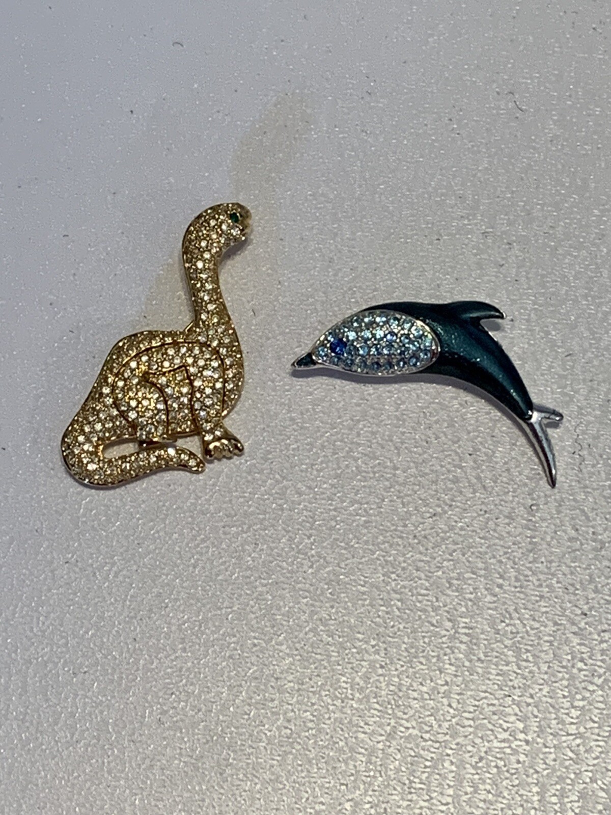 2 Swarovski brooch pins, dinosaur, dolphin, beautiful, VGC