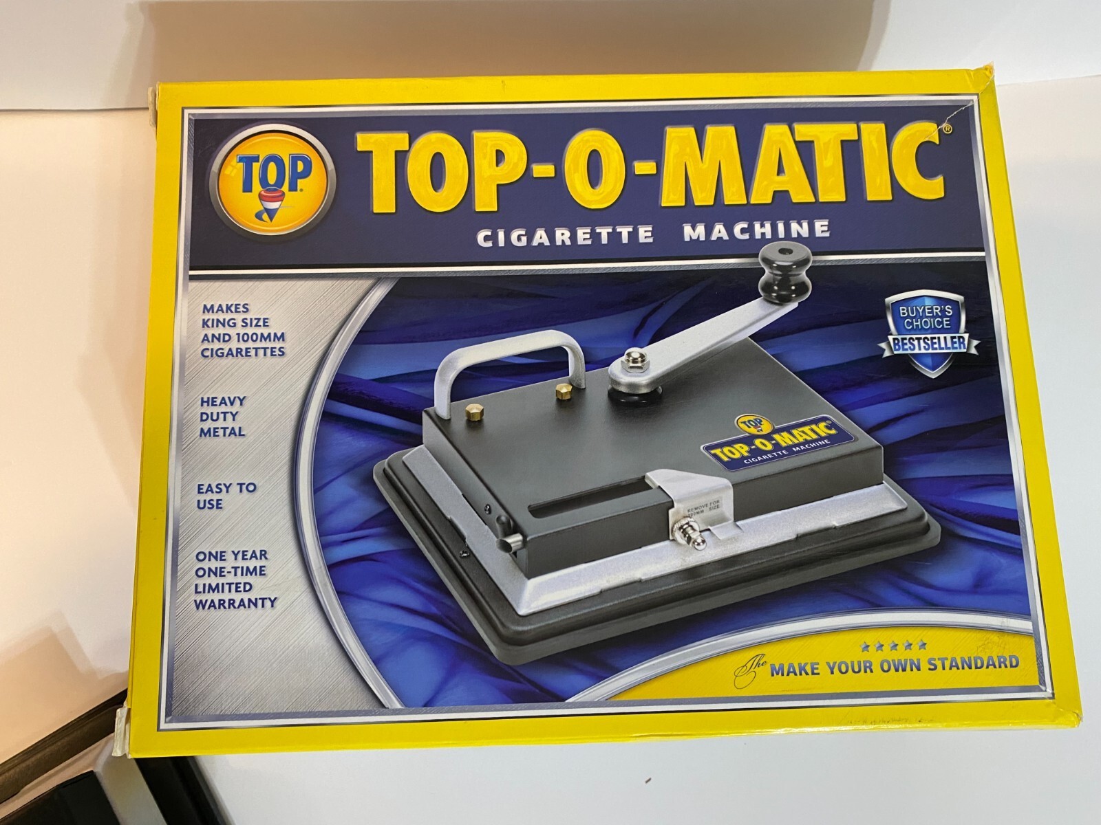 BRAND NEW, OPEN BOX, NEVER USED, TOP-O-MATIC CIGARETTE ROLLING MACHINE.