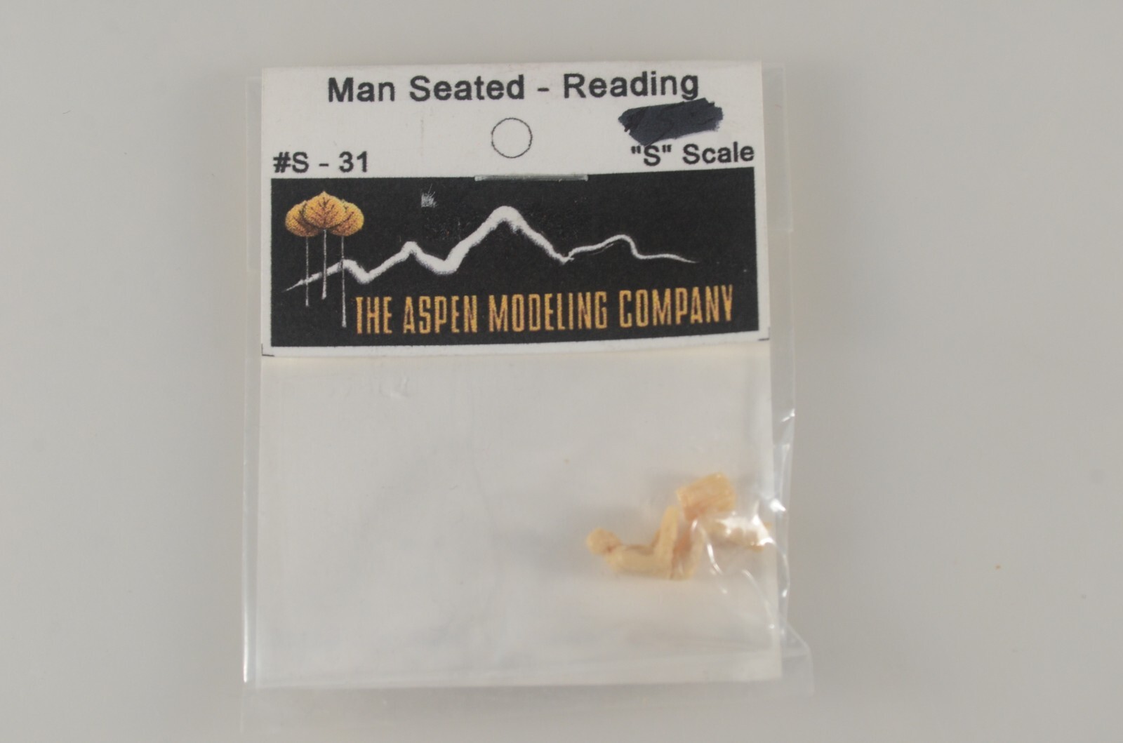 Aspen Modelling S Scale Unpainted Resin Man Seated Reading - S-31