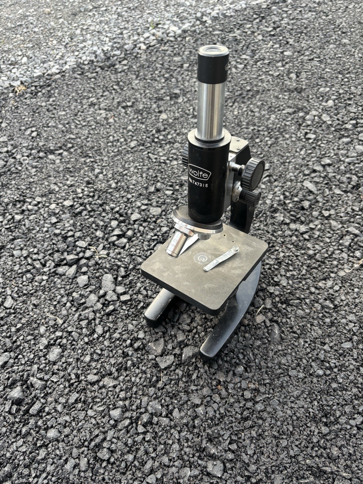 This is a vintage Wolfe student microscope likely imported from Japan,