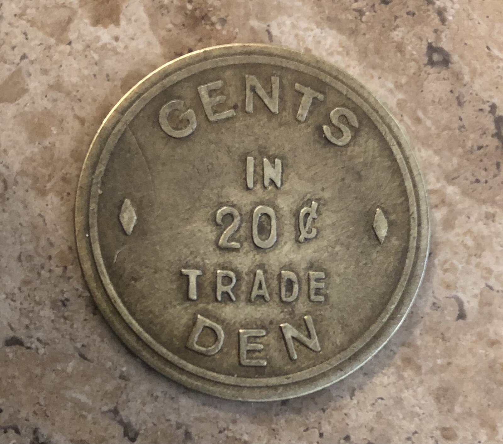 Vintage Brass Trade Token: GENTS DEN; Harvard Nebraska;  20 Cents in Trade