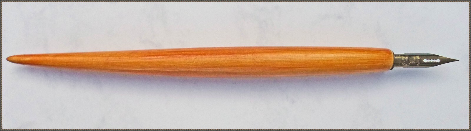 One vintage wooden penholder with a  Montgolfier 171 EF nib