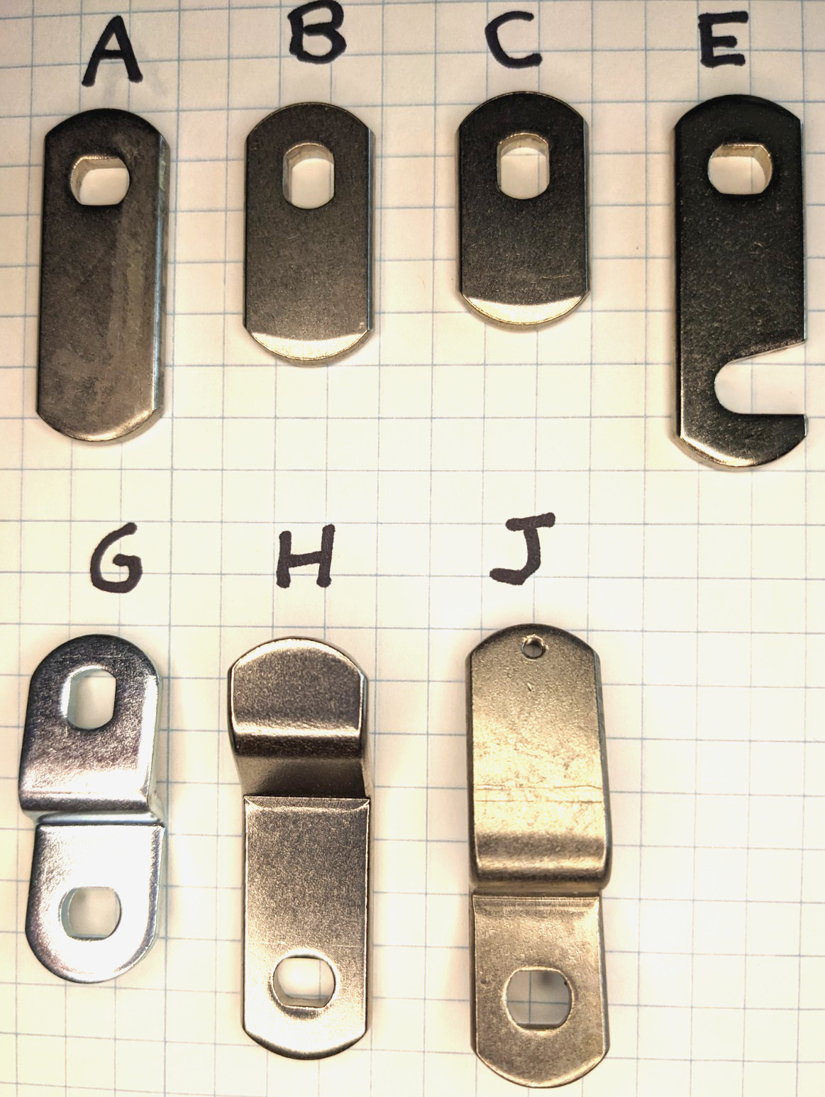 7 pc. Cam assortment for Medeco Cam Locks.  4 Straight and 3 Offset cams.
