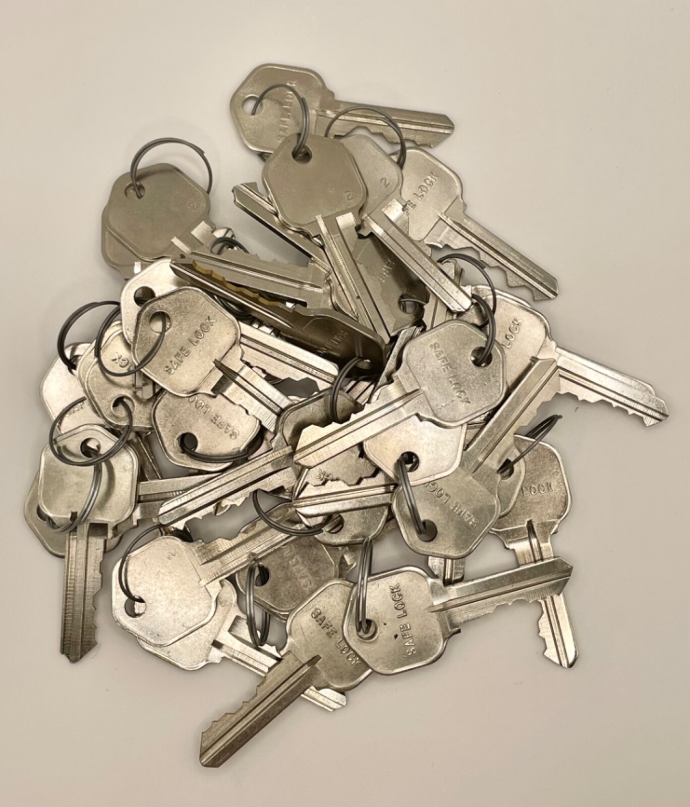 Safe Lock brand Kwikset KW1 precut keys. Nickel plated. 20 pairs (40 keys total)