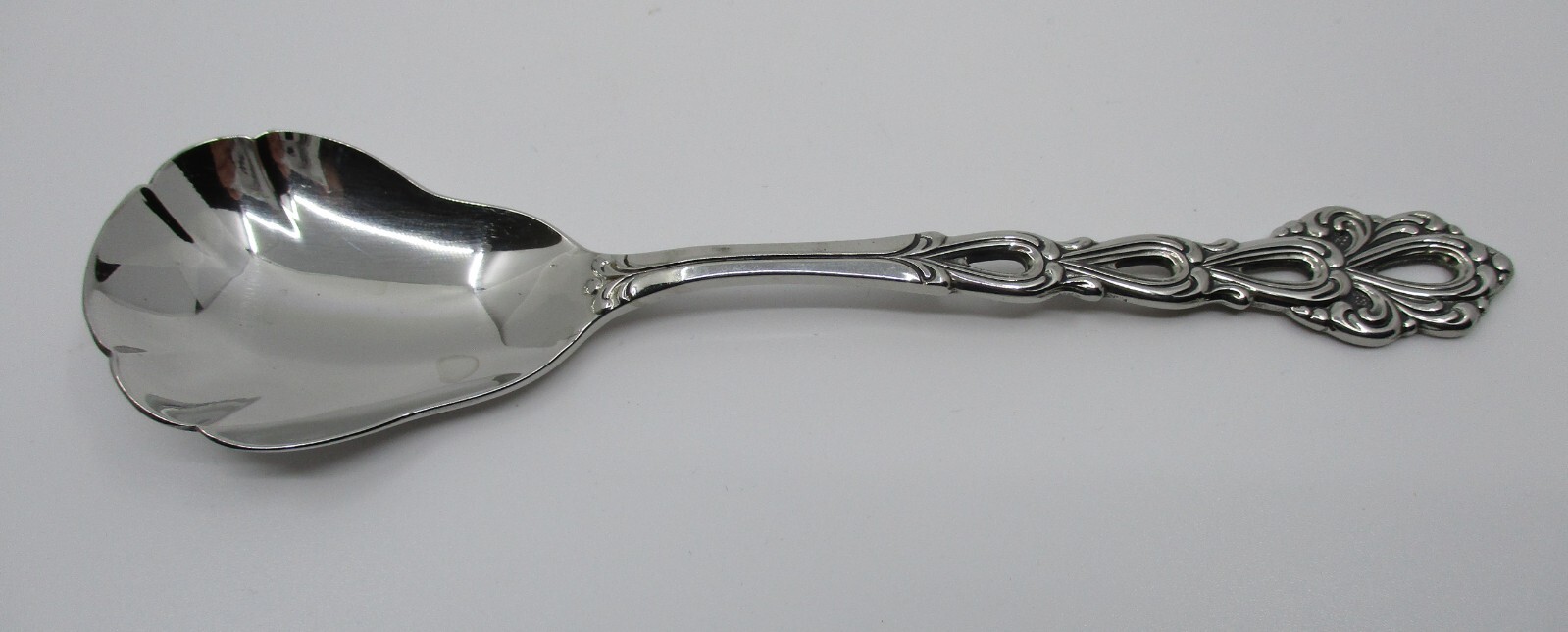 ONEIDA STAINLESS CHANDELIER SUGAR SPOON - 6"- 11B