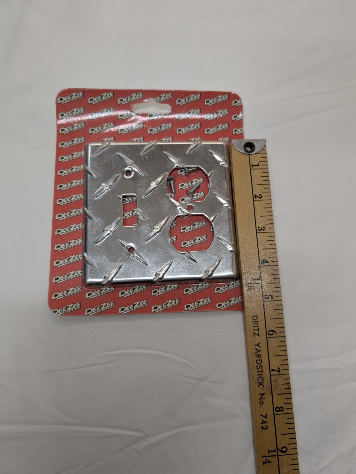 2 PCs DeeZee Brite Tread Outlet Cover. New Unopened Damaged Package