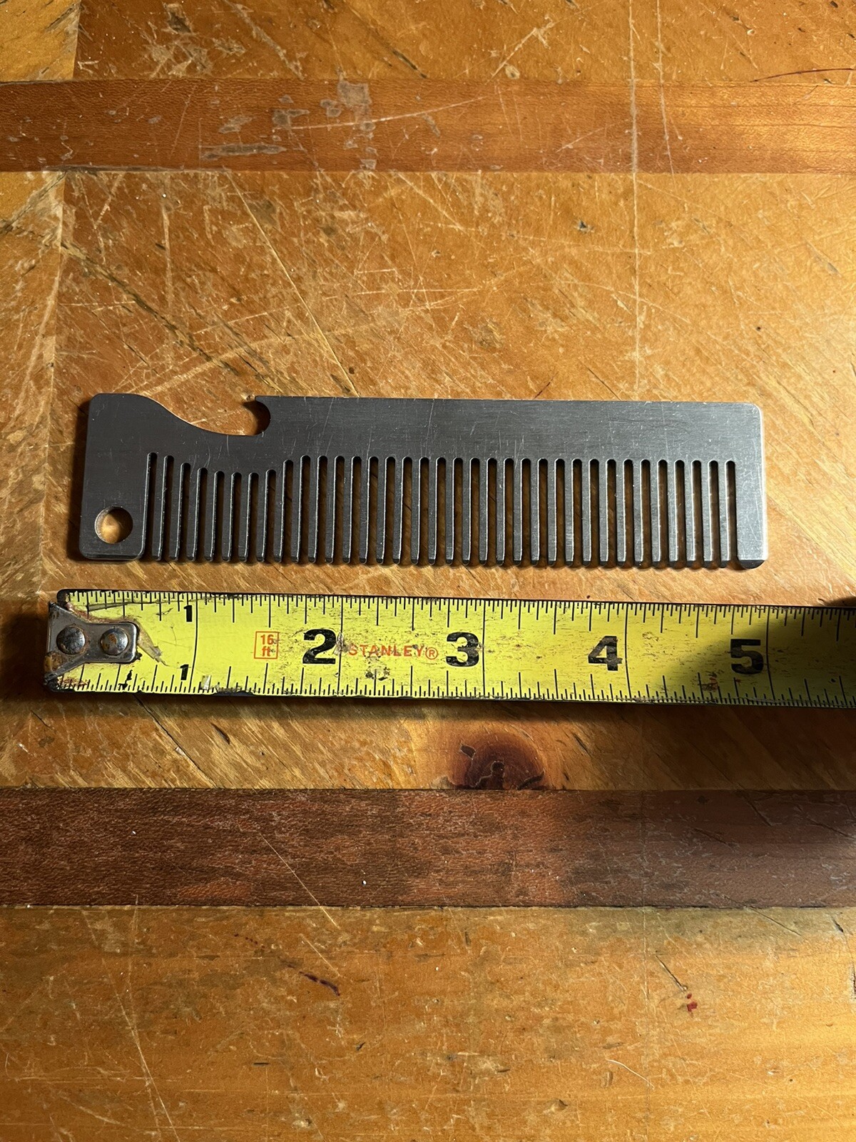 PROTOTYPE  aluminum comb/bottle opener, great idea, never made it to market.￼