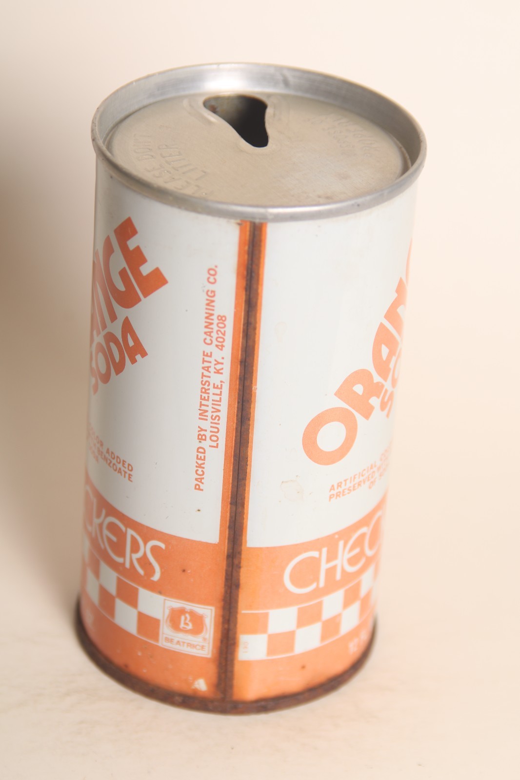 Checkers Orange soda can
