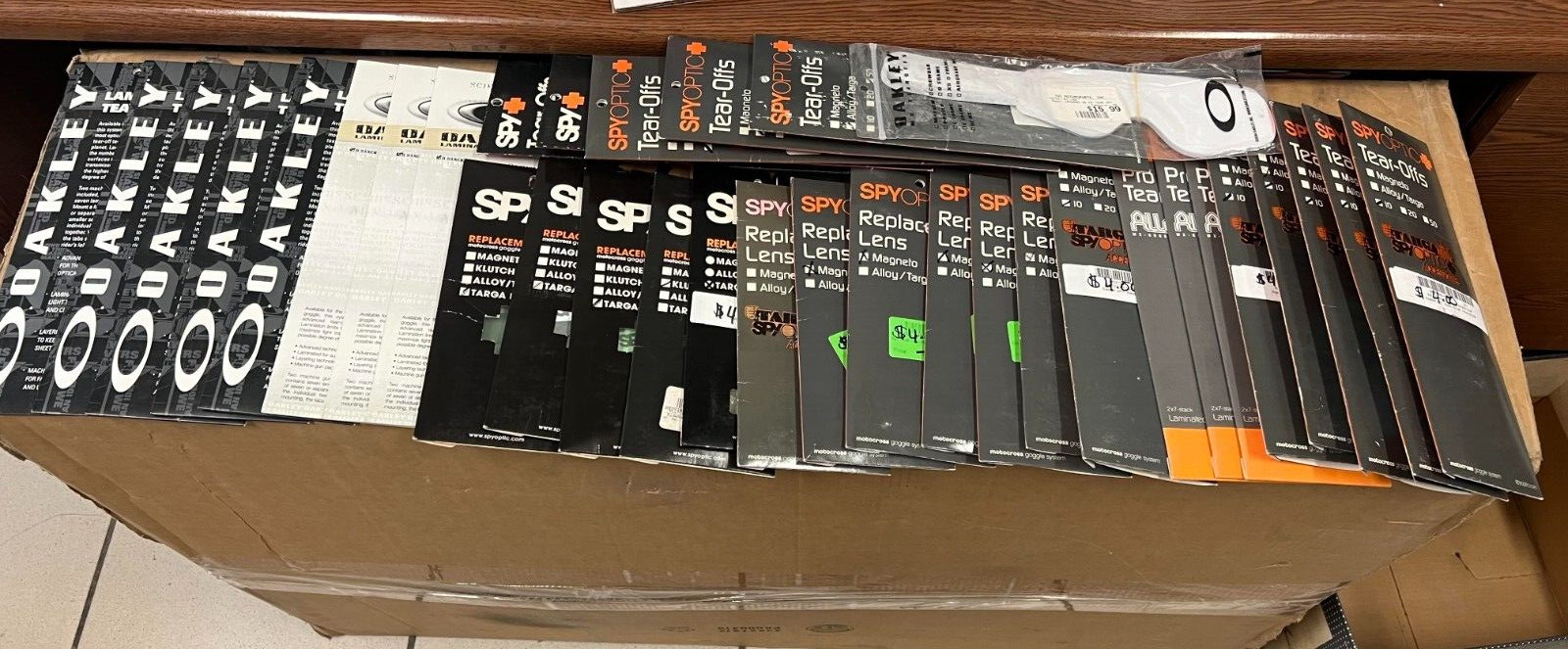 BULK SET OF SPY AND OAKLEY TEAR OFFS AND LENS (LOT OF 32)