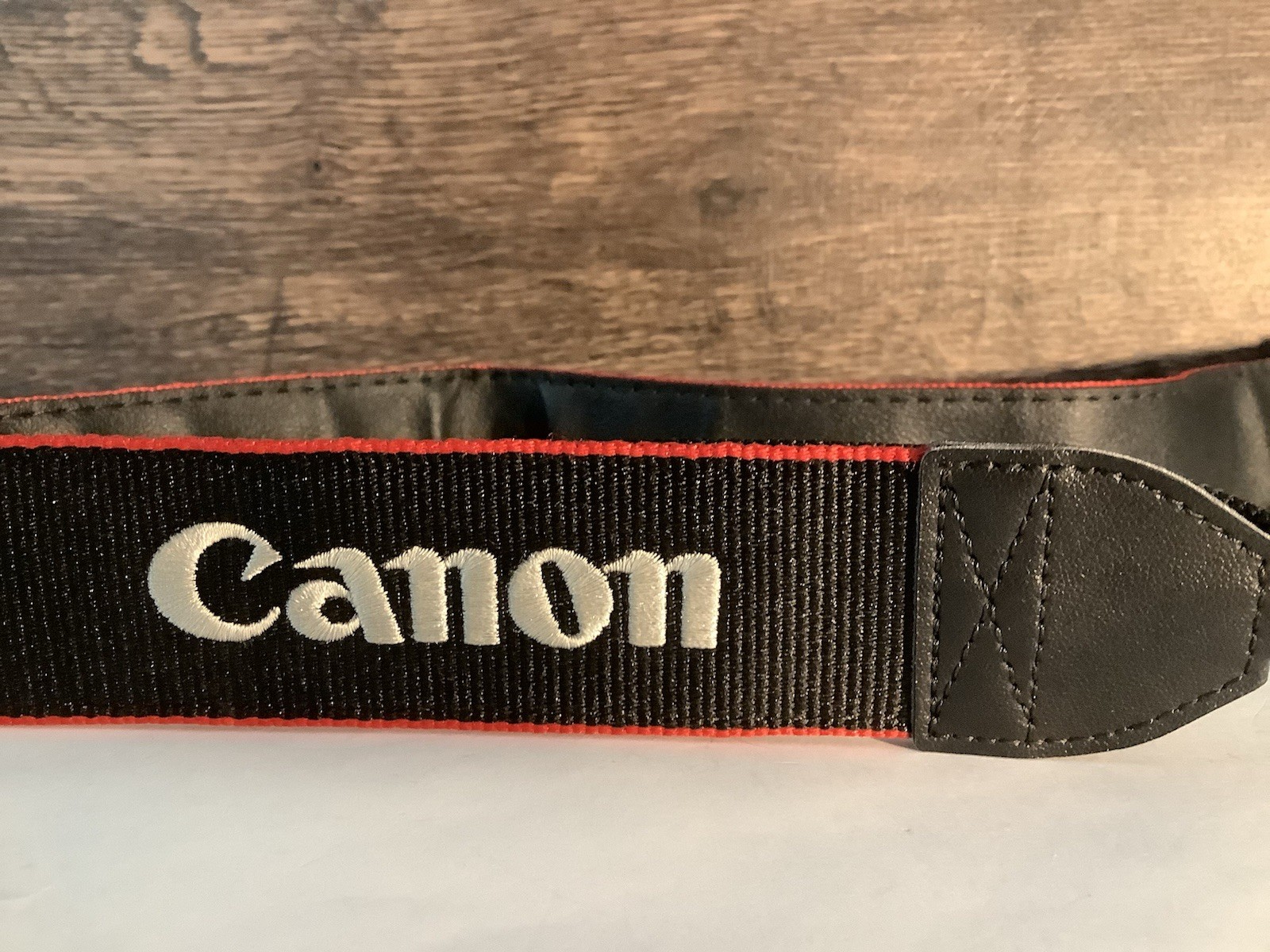 CANON EOS DIGITAL  Adjustable Wide Shoulder Strap  26" x 1  1/2",  Black/Red