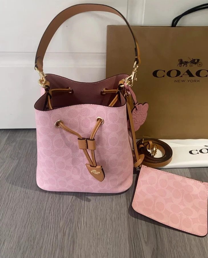 Coach CEA23 Rowan Bucket Bag In Signature Canvas With Charms Powder Pink Outlet