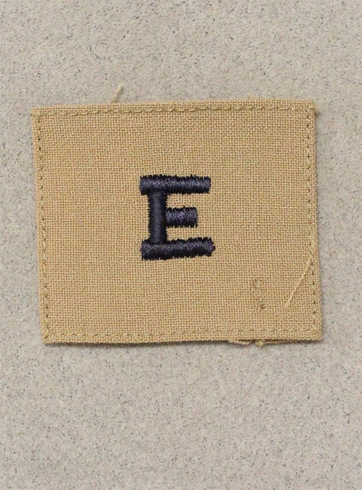 USN Navy Distinguishing Mark 1132: Navy "E" - navy blue on khaki